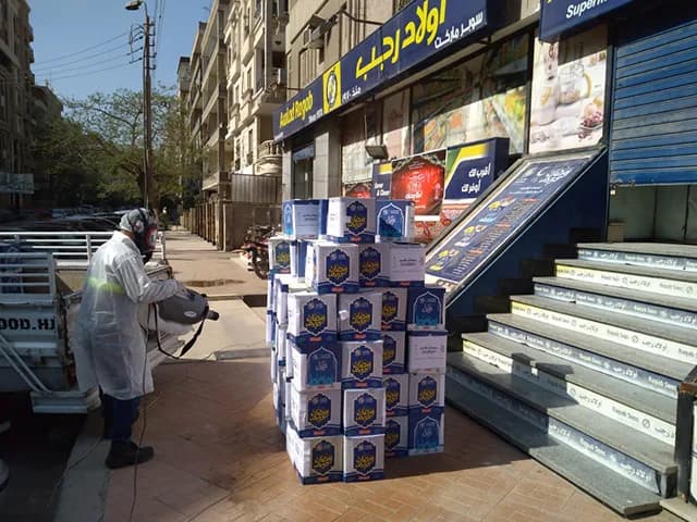 Ramadan food packages being distributed to families from the back of a truck