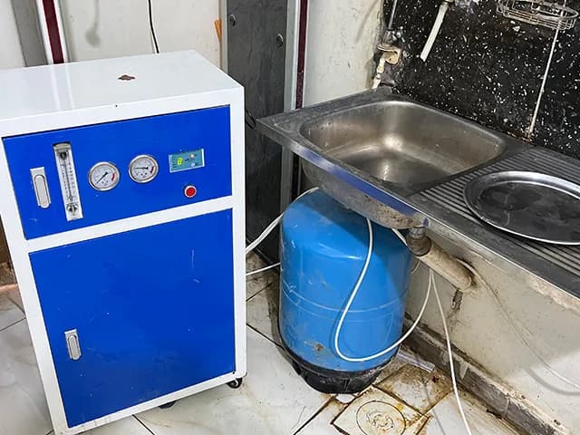 Residents at a completed water and sanitation installation